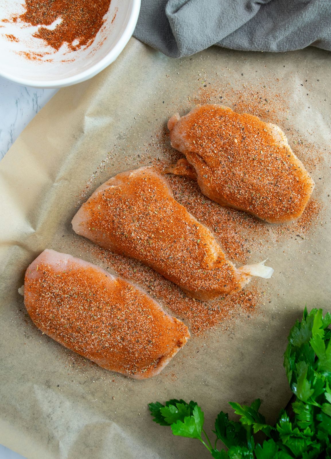 Marinated chicken thighs in the meat case