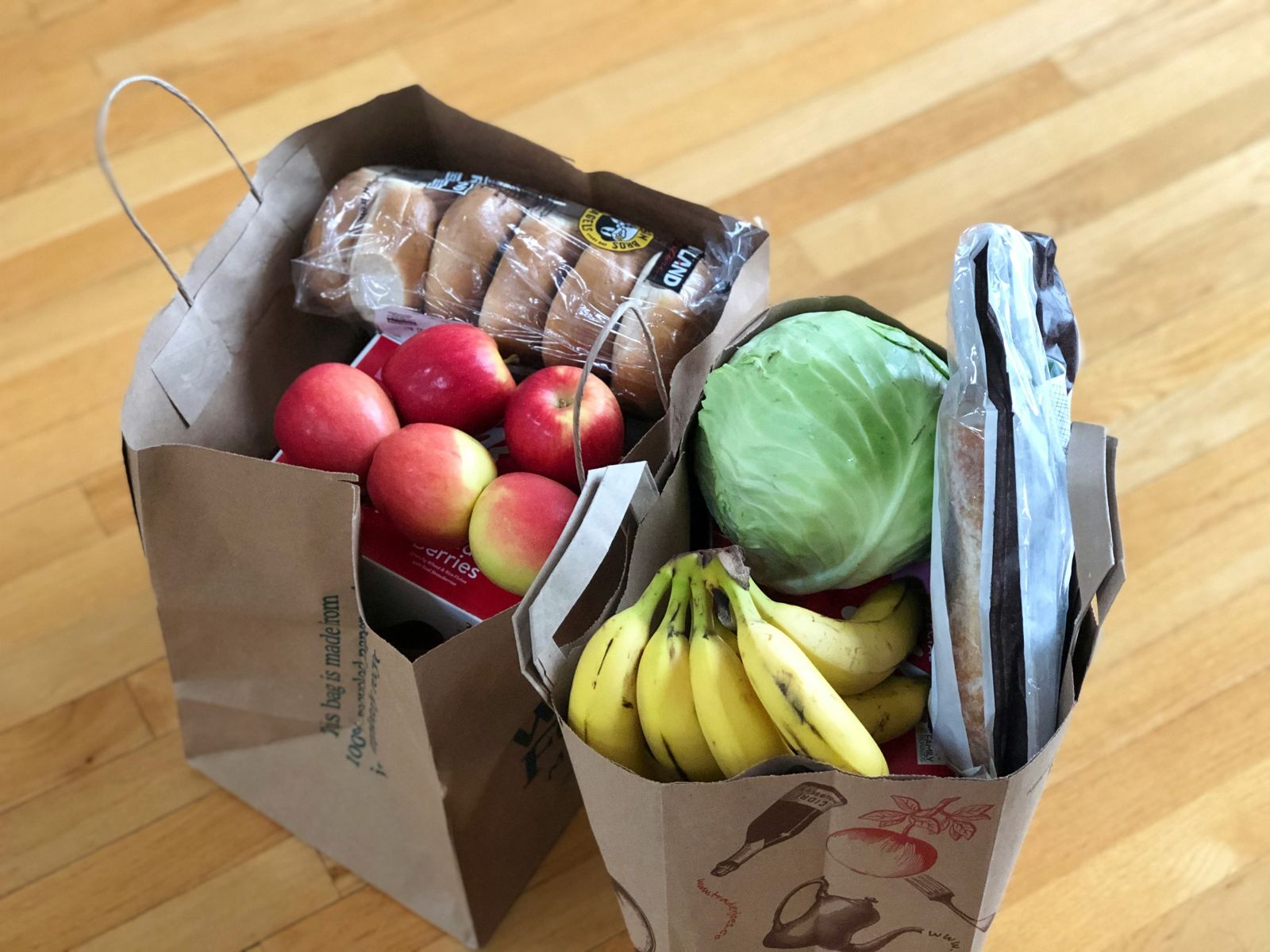 Paper grocery bags full of produce